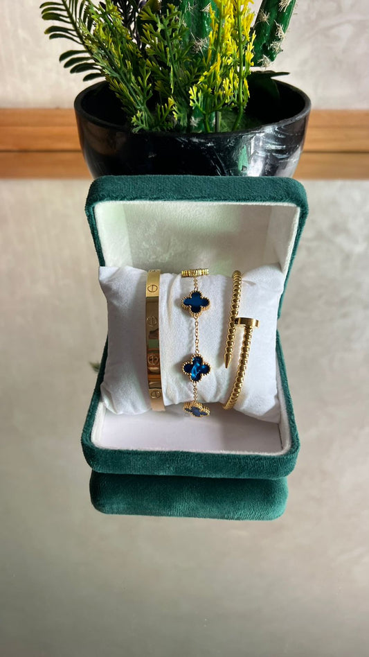 Ensemble Cartier, bracelet Van Cleef et jonc clou